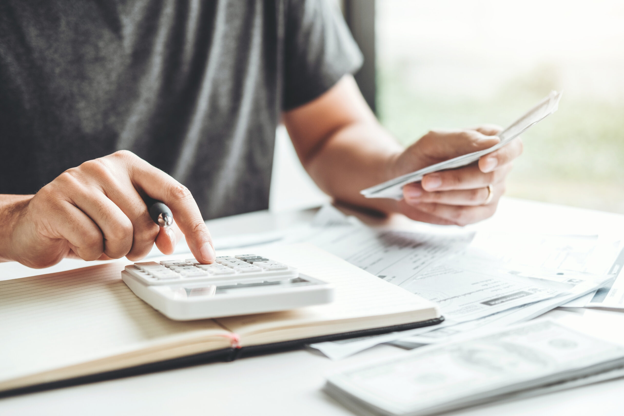 Man Using Calculator Accounting Calculating Cost Economic Bills With Money Stack Step Growing Growth Saving Money In Home , Finance Concept